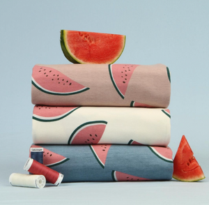 Stack of Elvelyckan Watermelon print fabric in Rose, Creme and Blue