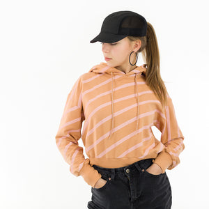 Photo of a womans sweatshirt/jersey made from See You At Six Diagonals XL French Terry Fenugreek Brown with pink stripes and matching rib fabric