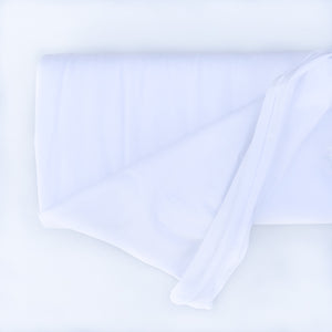 Roll of Elvelyckan plain white solid organic jersey cotton fabric on a white background
