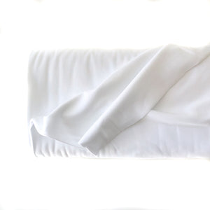Roll of Elvelyckan White Organic Cotton Jersey Rib Fabric on a white background